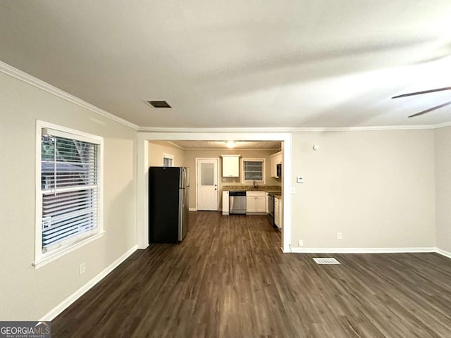 2239 Nelms Dr SW, Atlanta, GA 30315 - unfurnished living room featuring dark wood-type flooring, baseboards, crown molding, a sink, and ceiling fan