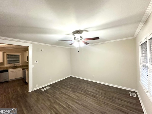 2239 Nelms Dr SW, Atlanta, GA 30315 - unfurnished room featuring ceiling fan, dark wood-style flooring, baseboards, crown molding, and a sink