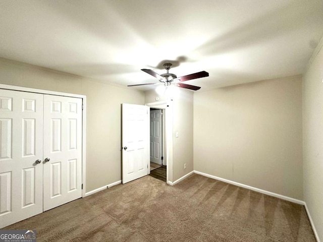 2239 Nelms Dr SW, Atlanta, GA 30315 - unfurnished bedroom featuring carpet flooring, a closet, baseboards, and ceiling fan