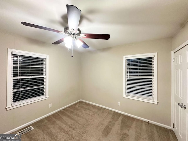 2239 Nelms Dr SW, Atlanta, GA 30315 - unfurnished bedroom with carpet flooring, baseboards, and a ceiling fan