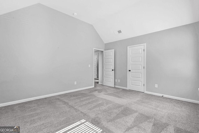 4238 Sir Dixon Dr, Fairburn, GA 30213 - unfurnished bedroom with vaulted ceiling, carpet flooring, and baseboards