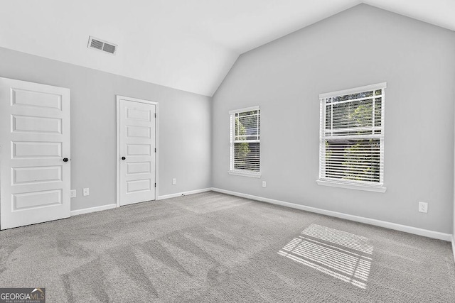 4238 Sir Dixon Dr, Fairburn, GA 30213 - unfurnished bedroom with vaulted ceiling, carpet flooring, and baseboards
