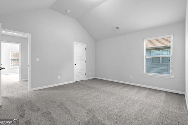 4238 Sir Dixon Dr, Fairburn, GA 30213 - unfurnished bedroom featuring lofted ceiling, carpet floors, and baseboards