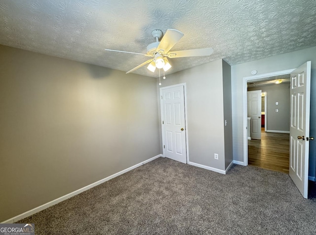3292 Shady Valley Ct, Loganville, GA 30052 - unfurnished bedroom with carpet, ceiling fan, and a textured ceiling