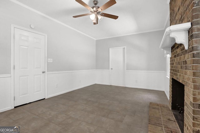 752 Roxboro Trce, Lawrenceville, GA 30044 - unfurnished living room with a ceiling fan, a wainscoted wall, a fireplace, and ornamental molding
