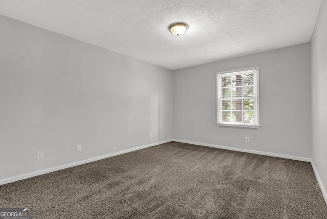 752 Roxboro Trce, Lawrenceville, GA 30044 - carpeted spare room featuring baseboards and a textured ceiling