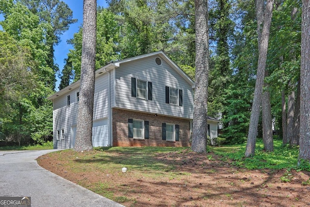 752 Roxboro Trce, Lawrenceville, GA 30044 - view of front facade featuring an attached garage, brick siding, and concrete driveway