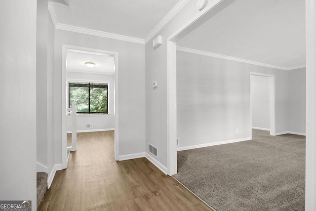 752 Roxboro Trce, Lawrenceville, GA 30044 - hallway featuring crown molding, baseboards, and wood finished floors