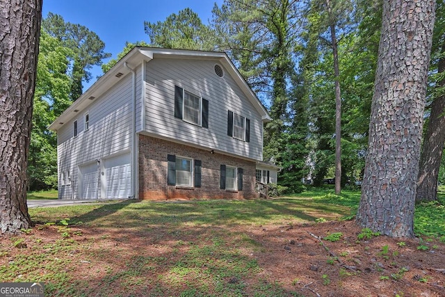 752 Roxboro Trce, Lawrenceville, GA 30044 - view of front of house featuring brick siding, a garage, and driveway