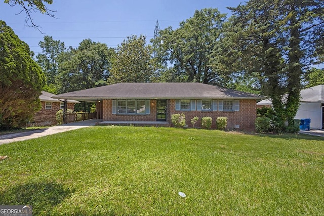2261 Star Mist Dr SW, Atlanta, GA 30311 - ranch-style house with driveway, a front lawn, an attached carport, and brick siding