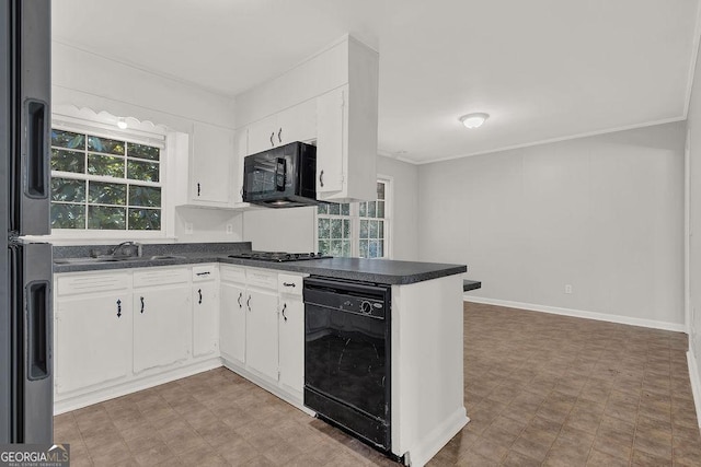 2261 Star Mist Dr SW, Atlanta, GA 30311 - kitchen with black appliances, dark countertops, light floors, a sink, and crown molding
