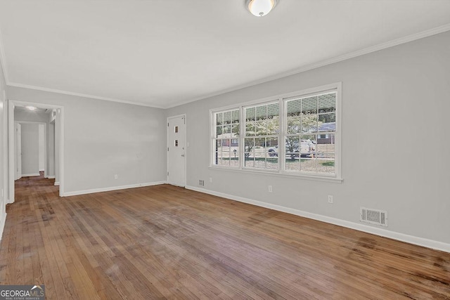 2261 Star Mist Dr SW, Atlanta, GA 30311 - empty room with wood finished floors, baseboards, and ornamental molding