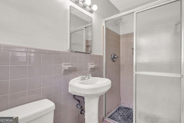 2261 Star Mist Dr SW, Atlanta, GA 30311 - full bath with toilet, a stall shower, tile walls, and a wainscoted wall