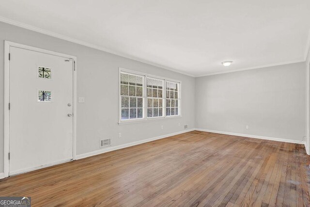 2261 Star Mist Dr SW, Atlanta, GA 30311 - entryway featuring ornamental molding, plenty of natural light, wood-type flooring, and baseboards