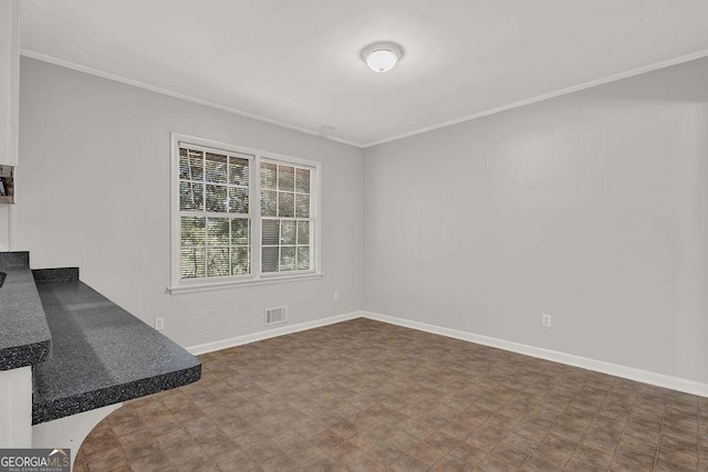 2261 Star Mist Dr SW, Atlanta, GA 30311 - unfurnished living room with ornamental molding and baseboards