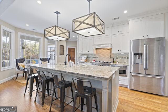 572 Austin Rd, Newnan, GA 30263 - kitchen featuring high end fridge, white cabinetry, decorative backsplash, light wood-style floors, and recessed lighting