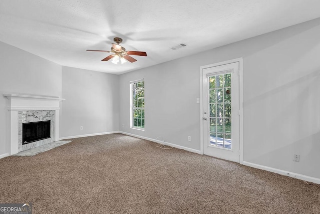 6541 Lazy Creek Ct, Lithonia, GA 30058 - unfurnished living room with a ceiling fan, baseboards, carpet, and a textured ceiling
