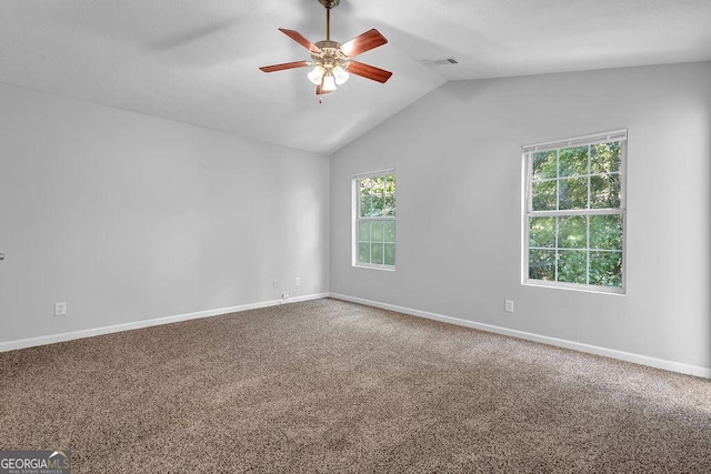 6541 Lazy Creek Ct, Lithonia, GA 30058 - carpeted spare room featuring ceiling fan, healthy amount of natural light, vaulted ceiling, and baseboards