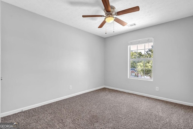 6541 Lazy Creek Ct, Lithonia, GA 30058 - spare room with ceiling fan, carpet flooring, a textured ceiling, and baseboards