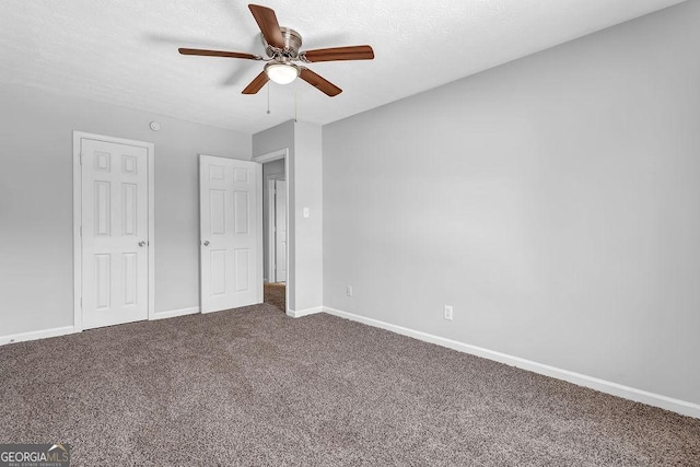 6541 Lazy Creek Ct, Lithonia, GA 30058 - unfurnished bedroom featuring carpet flooring, baseboards, and ceiling fan
