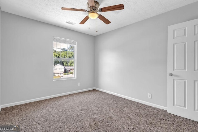 6541 Lazy Creek Ct, Lithonia, GA 30058 - empty room with carpet flooring, baseboards, ceiling fan, and a textured ceiling