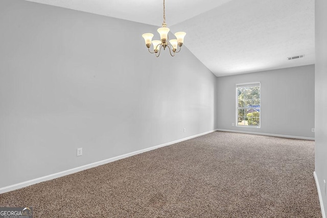 6541 Lazy Creek Ct, Lithonia, GA 30058 - spare room featuring vaulted ceiling, a chandelier, carpet, and baseboards