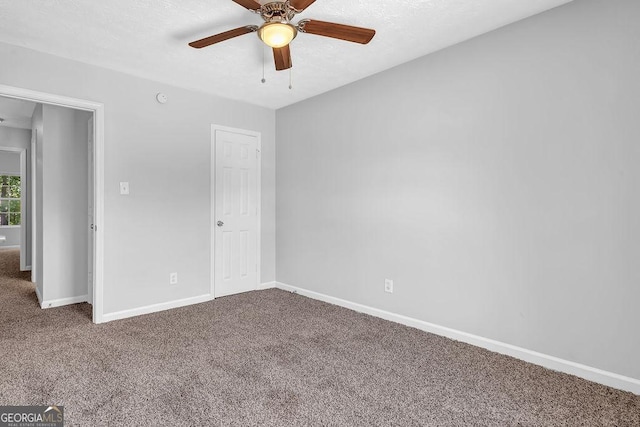 6541 Lazy Creek Ct, Lithonia, GA 30058 - unfurnished bedroom featuring carpet floors, baseboards, and a ceiling fan