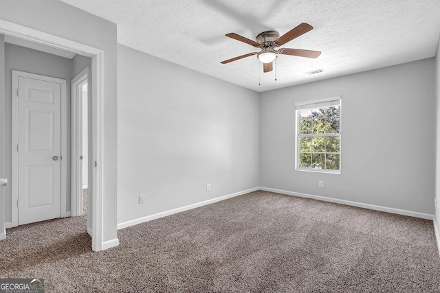 6541 Lazy Creek Ct, Lithonia, GA 30058 - unfurnished room featuring a ceiling fan, carpet floors, baseboards, and a textured ceiling