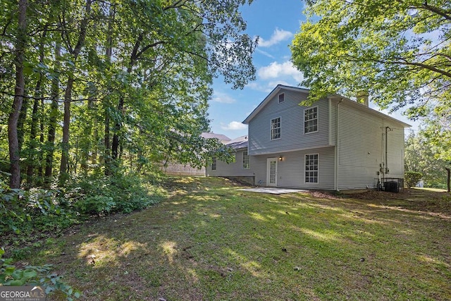 6541 Lazy Creek Ct, Lithonia, GA 30058 - rear view of house featuring a yard and a patio