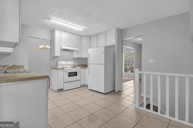 6541 Lazy Creek Ct, Lithonia, GA 30058 - kitchen with white appliances, a sink, under cabinet range hood, white cabinetry, and light tile patterned floors