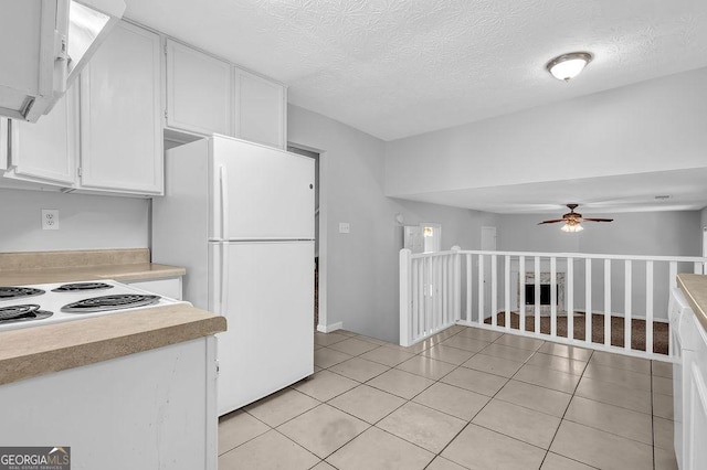 6541 Lazy Creek Ct, Lithonia, GA 30058 - kitchen featuring white appliances, white cabinetry, ceiling fan, light countertops, and a textured ceiling