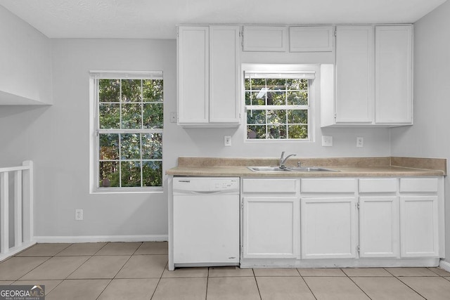 6541 Lazy Creek Ct, Lithonia, GA 30058 - kitchen with dishwasher, a sink, white cabinets, and light countertops