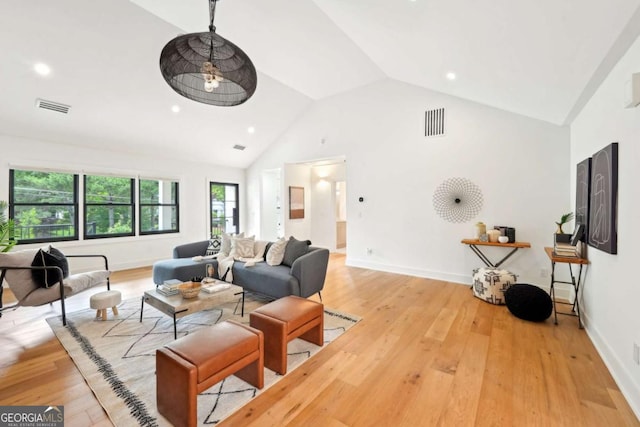 1815 Coventry Rd, Decatur, GA 30030 - living area with wood finished floors, baseboards, recessed lighting, and high vaulted ceiling