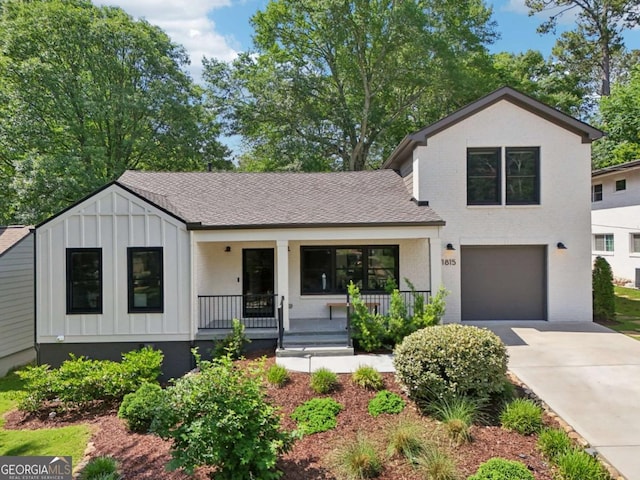 1815 Coventry Rd, Decatur, GA 30030 - modern farmhouse style home with board and batten siding, a porch, driveway, a garage, and roof with shingles