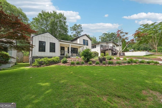 1815 Coventry Rd, Decatur, GA 30030 - view of front facade with board and batten siding and a front yard