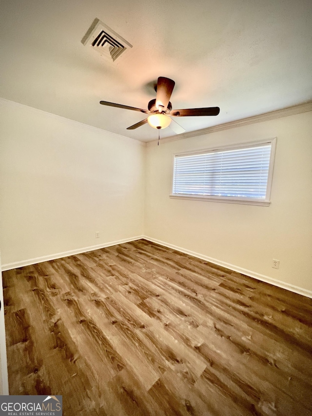108 Plum St, Dublin, GA 31021 - unfurnished room with wood finished floors, ceiling fan, baseboards, and crown molding
