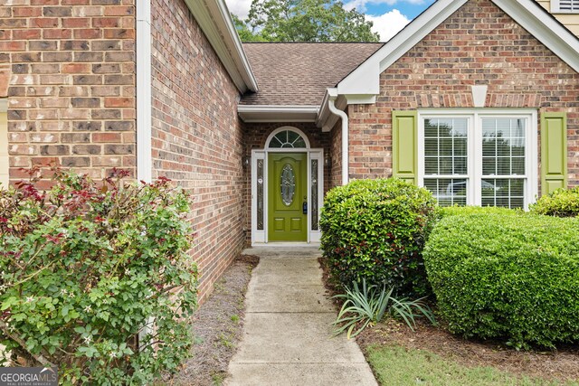 4801 Devonhurst Way, Powder Springs, GA 30127 - view of exterior entry with brick siding and roof with shingles