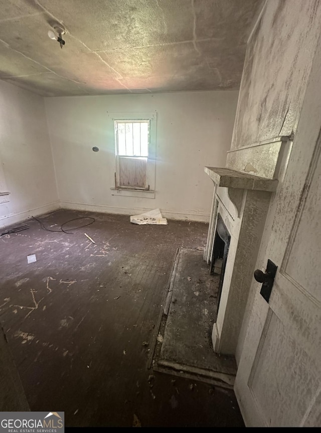 554 Nelson St, Macon, GA 31206 - unfurnished living room with a fireplace