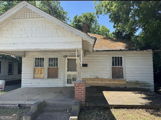 554 Nelson St, Macon, GA 31206 - view of front of property with a patio and a chimney
