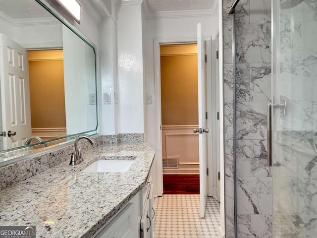 2751 Wayman Dr, Gainesville, GA 30506 - bathroom with a marble finish shower, vanity, ornamental molding, and tile patterned floors