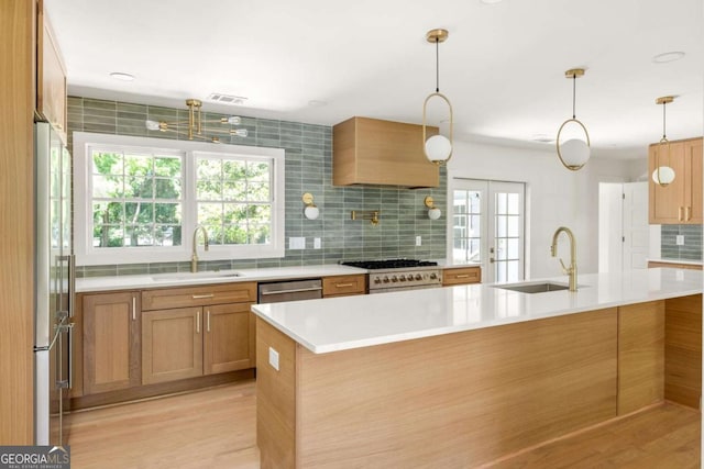 762 Rockbridge Rd NW, Lilburn, GA 30047 - kitchen with a sink, stainless steel appliances, decorative backsplash, and light countertops