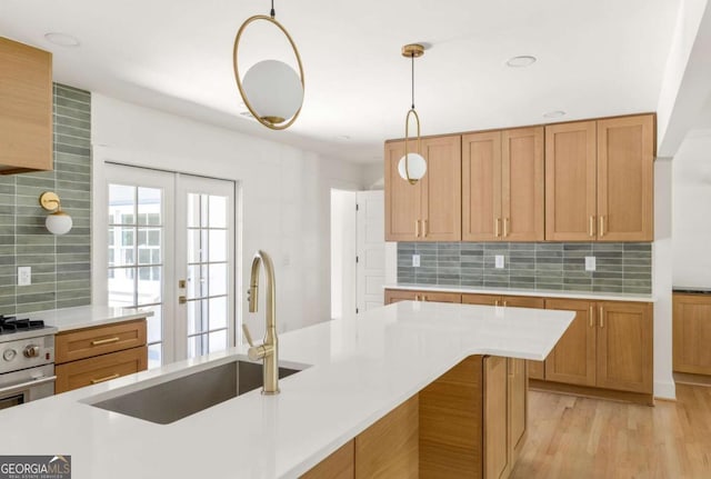 762 Rockbridge Rd NW, Lilburn, GA 30047 - kitchen featuring a sink, light countertops, tasteful backsplash, pendant lighting, and recessed lighting