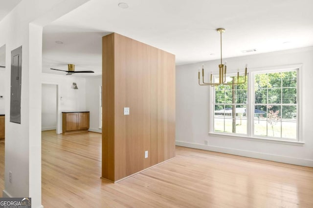 762 Rockbridge Rd NW, Lilburn, GA 30047 - spare room with light wood finished floors, a chandelier, baseboards, and ceiling fan