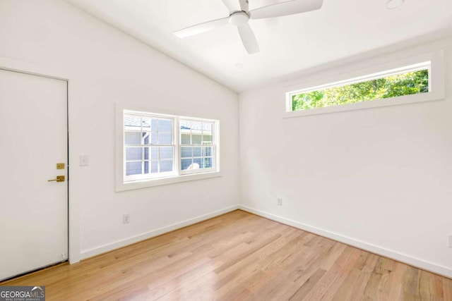 762 Rockbridge Rd NW, Lilburn, GA 30047 - unfurnished room featuring wood finished floors, lofted ceiling, baseboards, and a ceiling fan
