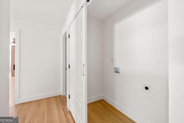 762 Rockbridge Rd NW, Lilburn, GA 30047 - hall with light wood-style flooring and baseboards