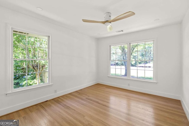 762 Rockbridge Rd NW, Lilburn, GA 30047 - empty room featuring baseboards, light wood-type flooring, and a ceiling fan
