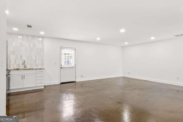 762 Rockbridge Rd NW, Lilburn, GA 30047 - bar featuring finished concrete flooring, recessed lighting, and baseboards