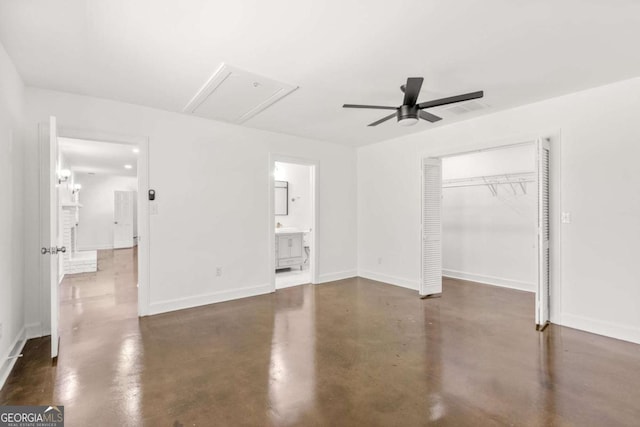 762 Rockbridge Rd NW, Lilburn, GA 30047 - unfurnished bedroom with attic access, finished concrete flooring, a closet, baseboards, and connected bathroom
