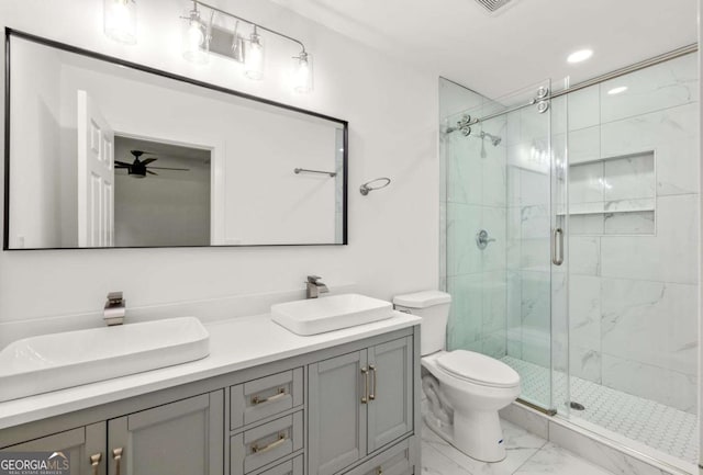 762 Rockbridge Rd NW, Lilburn, GA 30047 - bathroom with marble look tiles, a marble finish shower, double vanity, toilet, and a ceiling fan