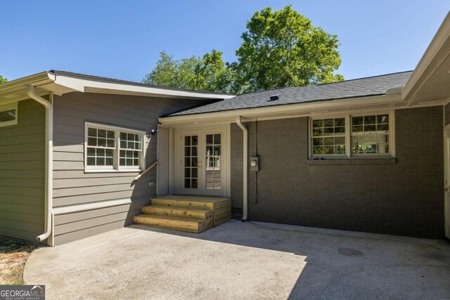 762 Rockbridge Rd NW, Lilburn, GA 30047 - doorway to property featuring french doors and a patio